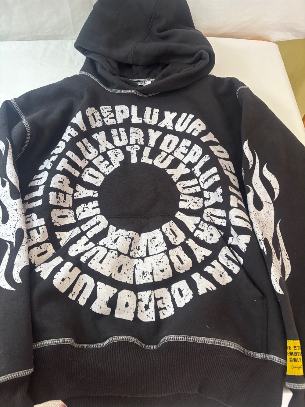 Black Graphic Hoodie with White Circular Text Print. Discontinued Graphic Print
